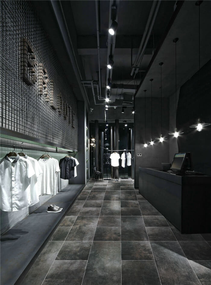 use large cement style tiles to decorate fashion shop entrance.jpg