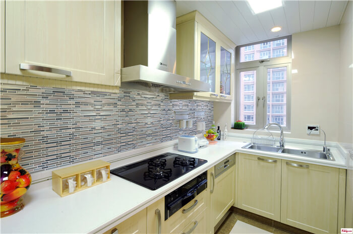 kitchen backsplash uses strip mosaic tile to stretch the space.jpg