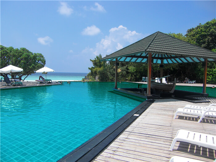 resort swimming pool uses 4x4 pool tile to create noble design.jpg