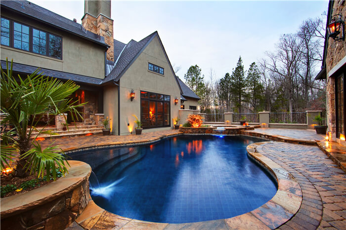 cobalt blue mosaic pool tiles match well with the house design.jpg