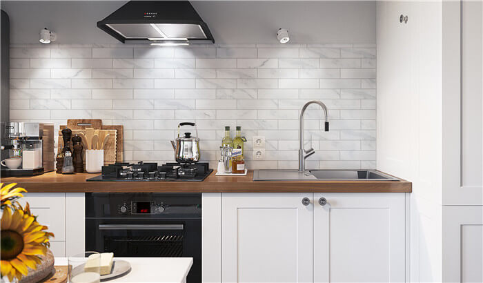 kitchen backsplash using brickbond porcelain tile that looks like marble.jpg