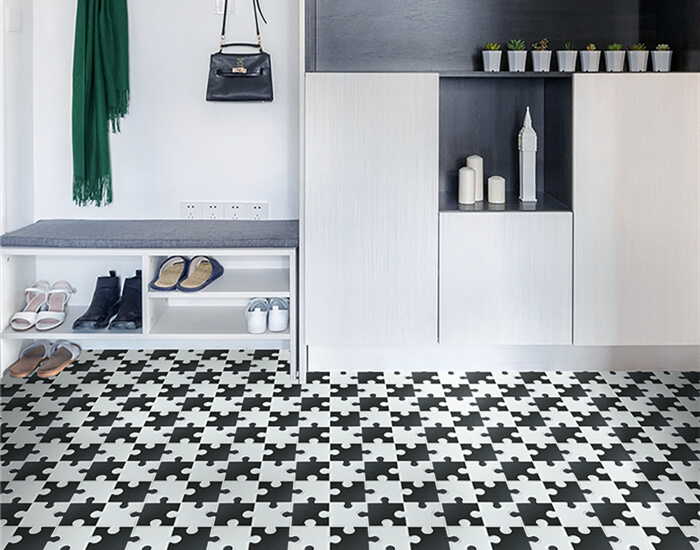 entryway using black and white interlocking mosaic tile for floor paving.jpg