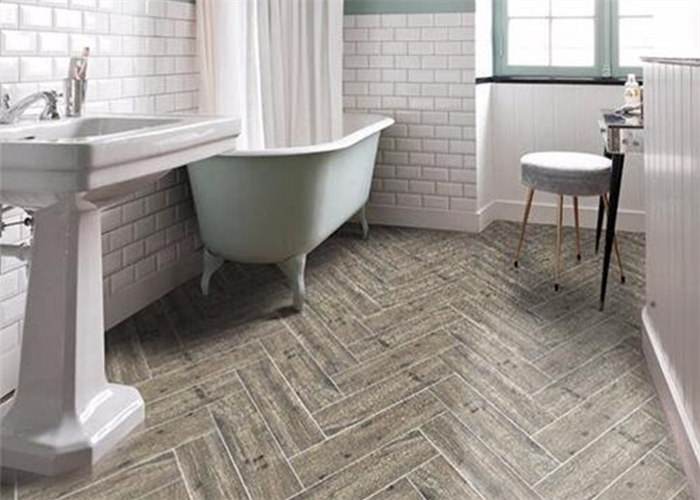 bathroom using herringbone wood like floor tiles.jpg