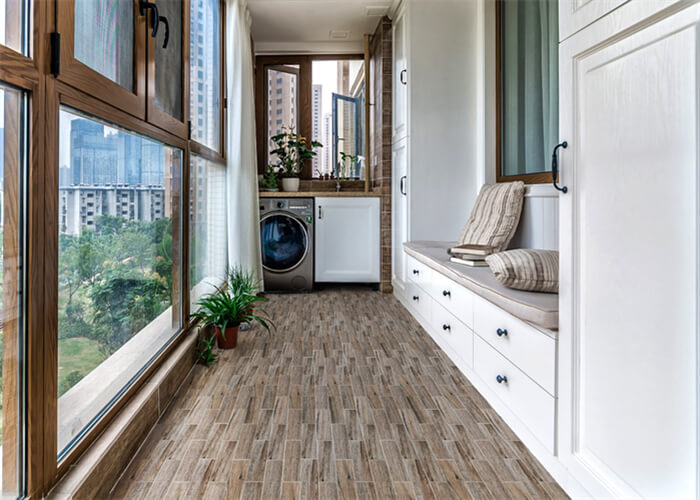 passage towards bathroom using wear resistant wood like porcelain tile on floor.jpg