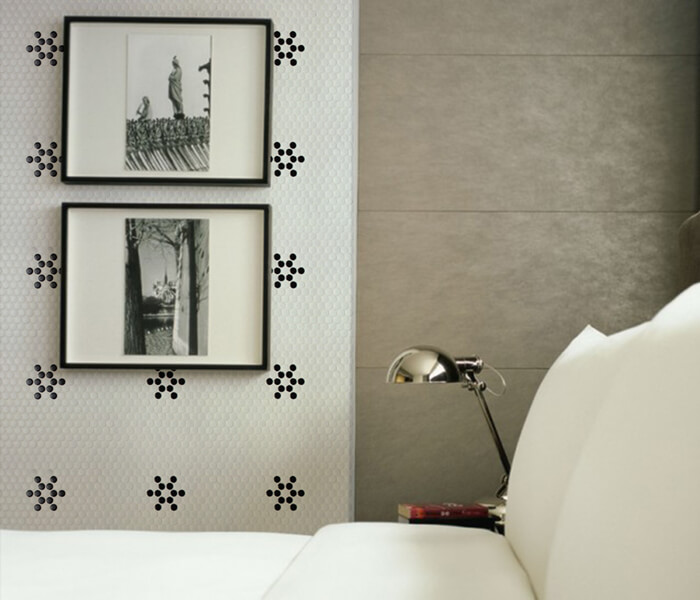 bedroom using black white flower pattern penny tile on wall.jpg