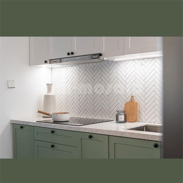 white herringbone tile backsplash